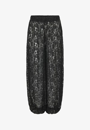 Pantalon large noir avec superposition de dentelle florale, taille et poignets élastiques, design semi-transparent.