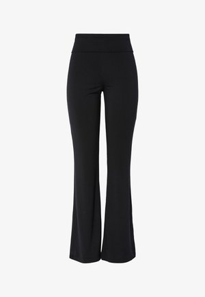 Mustad kõrge vöökohaga venivad püksid, millel on veidi laienev sääreosa ja sile, õmblusteta disain valgel taustal.