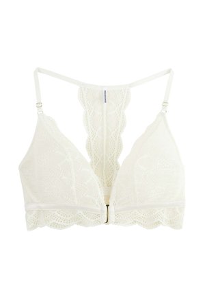 Bralette en dentelle blanche avec bretelles réglables, fermeture à l'avant, et un panneau en dentelle dos nageur orné de motifs floraux complexes.