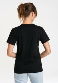 Black cotton t-shirt with short sleeves and a crew neck, featuring a smooth texture and fitted shape, shown from the back.