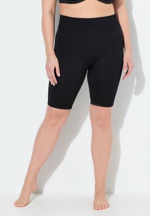 Schwarze, gerippte Radshorts aus dehnbarem Material, mit hohem Bund und knielangem Schnitt, glatter Textur und eng anliegendem Sitz.