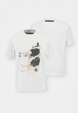 White cotton t-shirt featuring a large printed image of a black and white cow on the front. Simple crew neck and short sleeves.