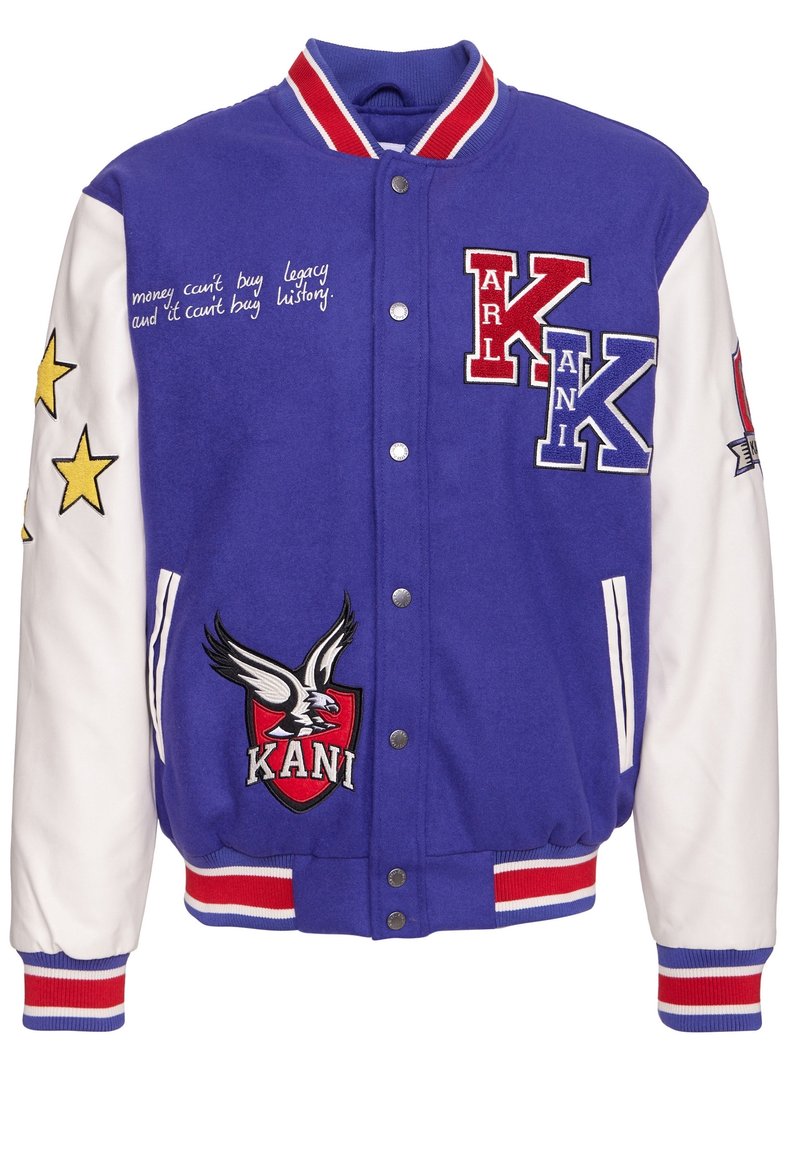 Lila varsityjacka med vita ärmar, broderade logotyper och stjärnor. Har snäppknappar, ribbat krage, cuffs och nederkant med röda och blå accenter.