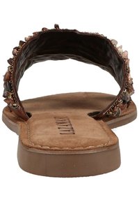 Brown flat sandals featuring a textured, open back and embellished upper with decorative beads. Soft suede insole with stitching detail.