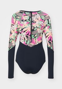 Langsleeve zwempak met een bloemenpatroon in roze, groen en beige, met een zwarte basis en een rits aan de achterkant. Ee zachte stoftextuur.