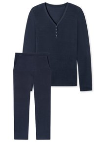 Top a maniche lunghe blu navy con scollo a V e dettagli con bottoni, abbinato a pantaloni coordinati con tasche e silhouette affusolata. Tessuto morbido.