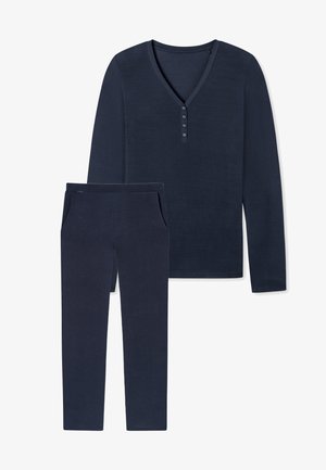 Granatowa bluzka z długim rękawem, z dekoltem w serek i detalami w postaci guzików, w połączeniu z dopasowanymi spodniami z kieszeniami i zwężanym krojem. Miękka tekstura.