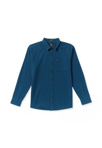 Chemise à manches longues de couleur bleu profond, en tissu lisse. Présente un devant à boutons, un col pointu et une poche poitrine unique. Boutons noirs.