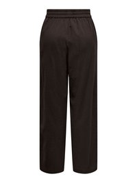 Pantalon noir ample avec une ceinture élastique, vu de dos sur fond blanc.