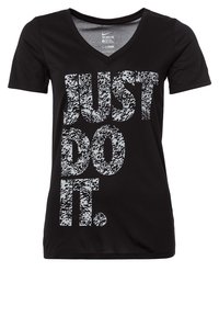 Black V-neck t-shirt featuring a large gray animal print text design that reads "JUST DO IT." Soft fabric with a fitted silhouette.