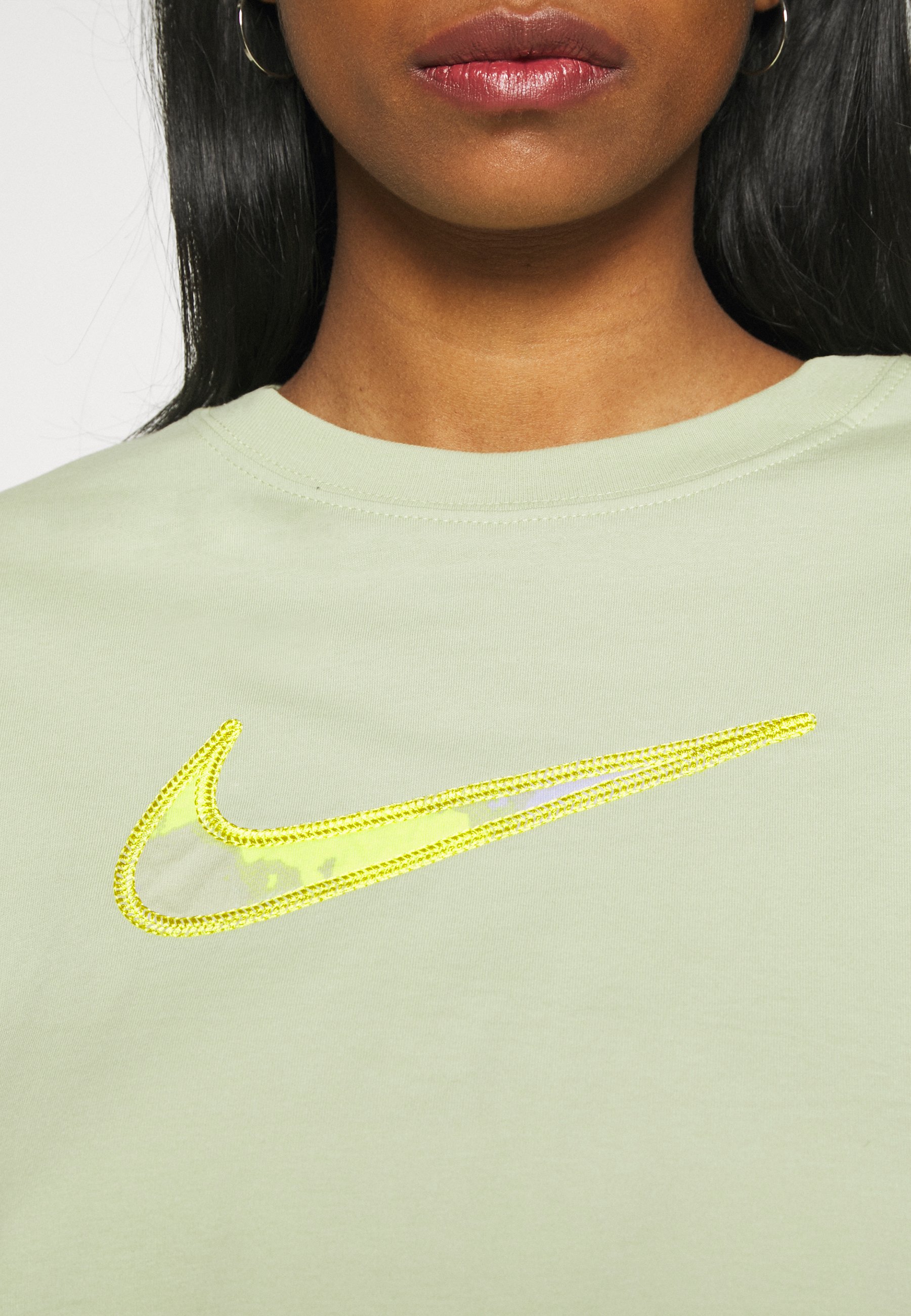 white and olive green nike shirt