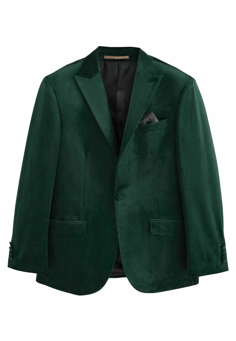 Blazer verde in velluto con rever a lancia, due tasche frontali, una tasca sul petto con un fazzoletto nero e chiusura a un bottone.