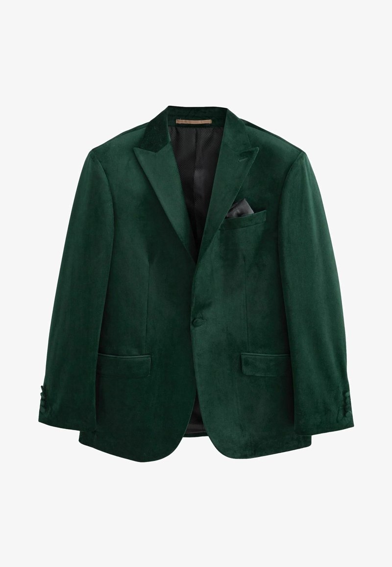 Blazer verde in velluto con rever a lancia, due tasche frontali, una tasca sul petto con un fazzoletto nero e chiusura a un bottone.