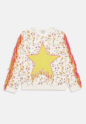 Cream sweatshirt with a large yellow star and colorful star patterns; features pink and orange fringe on sleeves; soft fabric.