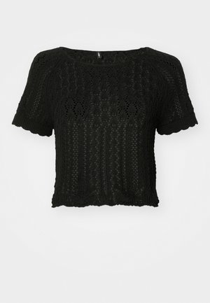 Top de malha preto, cropped, com mangas curtas, apresentando um padrão texturizado de renda e bordas em cascata na bainha e nas mangas.