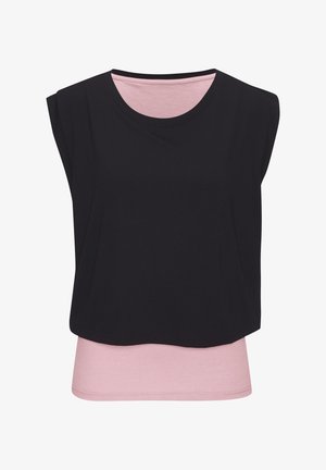 Sleeveless black cropped overlay top layered over a light pink fitted sleeveless shirt with round necklines.