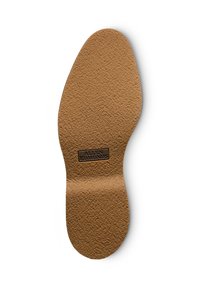 Insole in pelle marrone con superficie testurizzata e forma leggermente sagomata. Presenta un logo impresso al centro.