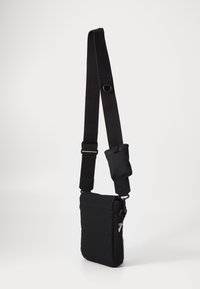 Carhartt WIP CARPENTER SHOULDER BAG UNISEX - Cross body bag - black