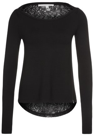 Blouse noire à manches longues avec décolleté rond et détails en dentelle visibles au niveau du décolleté et de l'ourlet.