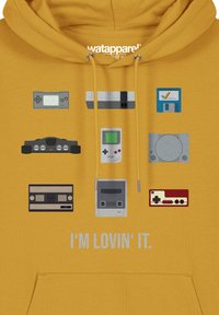 Yellow hoodie featuring various retro gaming console illustrations in gray, black, and green. Text reads, "I'M LOVIN' IT." underneath.