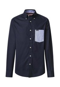 Donkerblauwe knoopshirt van katoen. Bevat een contrasterende lichtblauwe gestreepte zak en details aan de binnenkant van de kraag. Standaard pasvorm met lange mouwen.