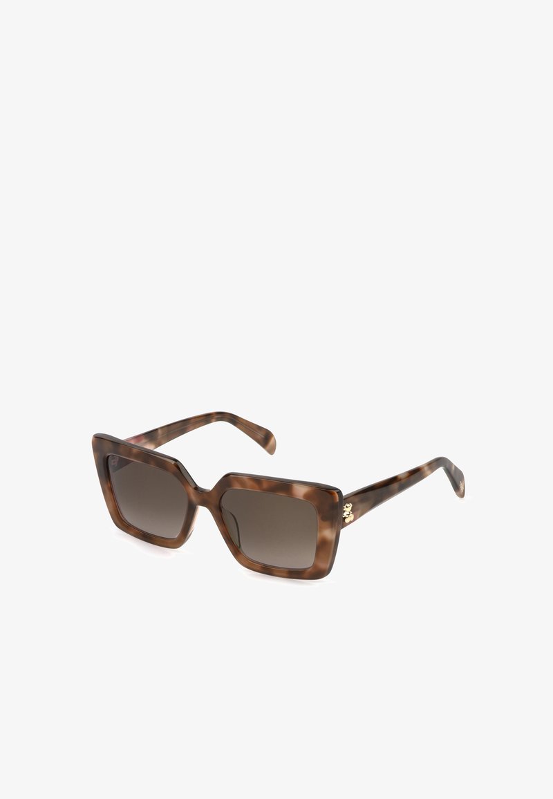 Lunettes de soleil carrées oversize en écaille marron foncé avec verres dégradés et petit détail doré sur les branches.