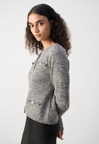Lindex LUMI - Adīta jaka - black