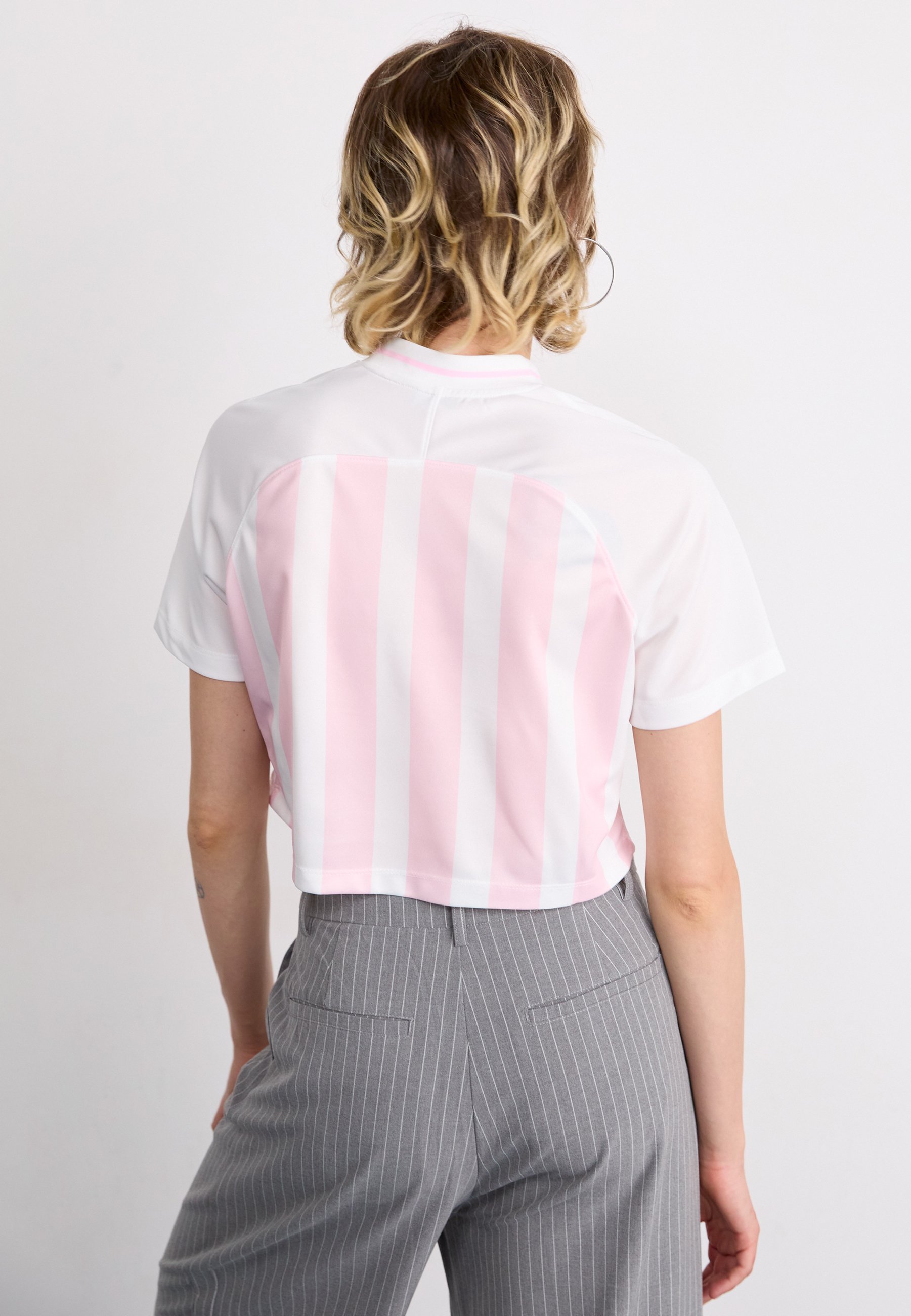 white nike shirt with pink check