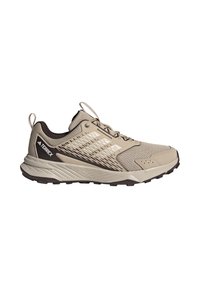 Chaussure de trail Adidas Terrex beige clair avec dessus en mesh, semelle noire et logo sur le talon sur fond blanc.