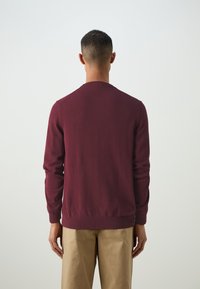 Lacoste Stickad tröja - bordeaux