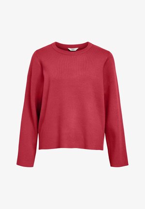 Maglione rosso realizzato in morbido tessuto a maglia. Caratterizzato da un collo rotondo, maniche lunghe e una vestibilità leggermente ampia con una superficie liscia.