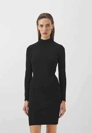 Black long-sleeve dress with a high neckline, form-fitting design, ribbed texture, and smooth fabric, reaching mid-thigh length.