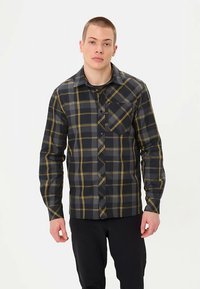 Zwart-grijs geruite blouse met gele accenten, lange mouwen, knoopsluiting aan de voorkant en een borstzak; gladde stoftextuur.