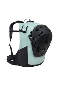 Uno zaino verde menta con fondo nero presenta spallacci regolabili, numerose cerniere e un supporto per il casco. Il design è compatto e funzionale.