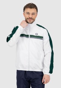 Weißer Zip-Up-Jacke mit grünen und marineblauen horizontalen Streifen, elastischen Bündchen und Logo auf der Brust. Hergestellt aus glattem, leichtem Material.