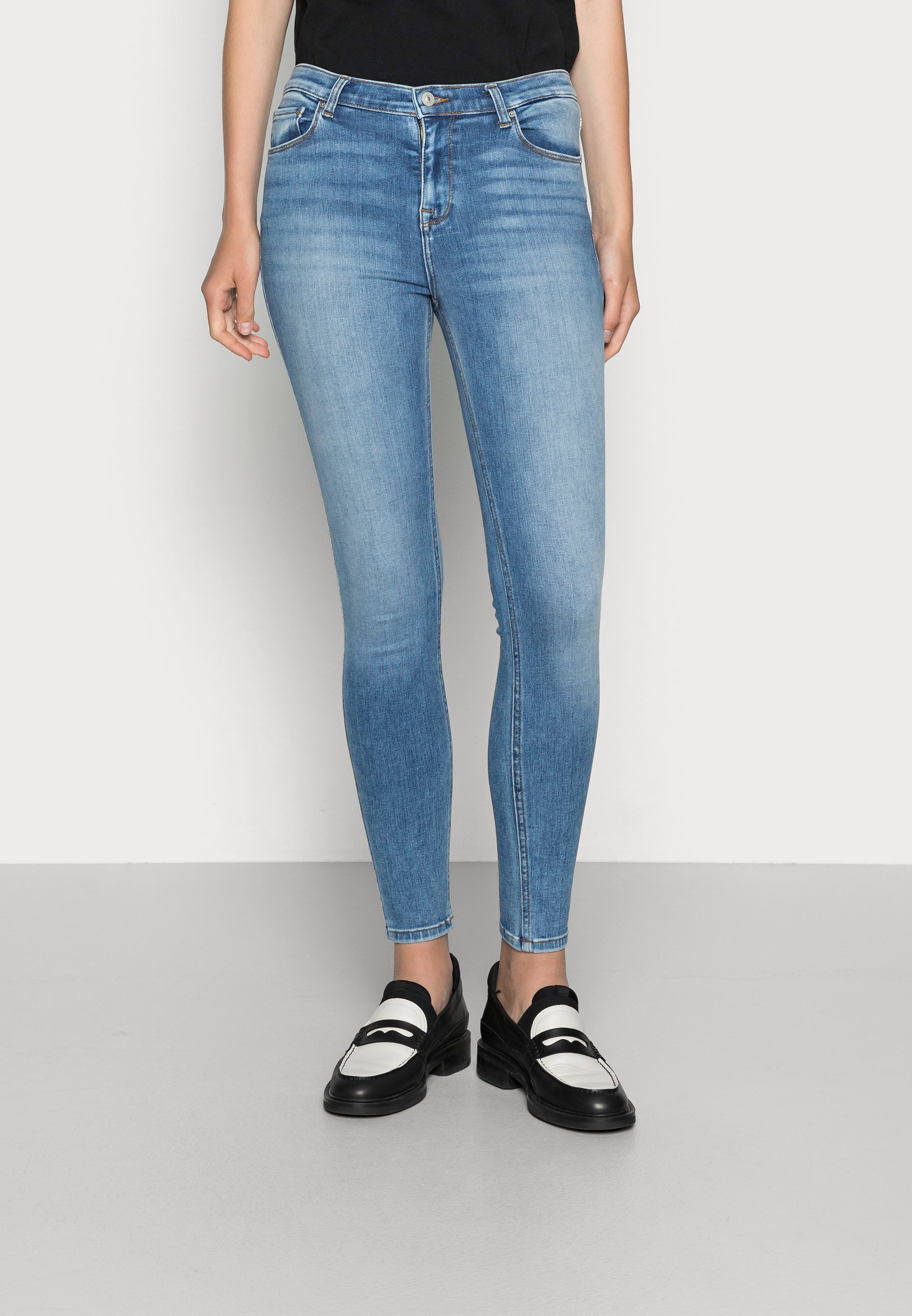 Denham Monroe mid waist slim fit jeans met ripped details • Indigo • de