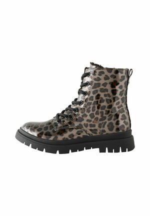 Glossy lace-up combat boot with black sole and leopard print pattern, designed for ankle support and casual fashion wear.
