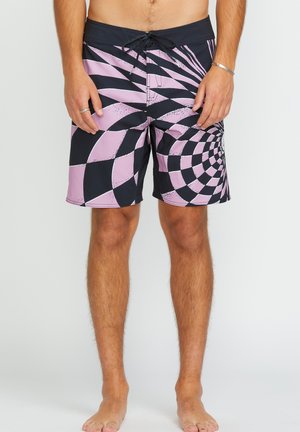 Pantaloni da bagno neri e rosa con un motivo a spirale, chiusura con cordino e tessuto testurizzato, ideali per attività acquatiche.