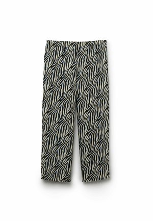 Pantalon droit avec motif zébré noir, blanc et bleu et ceinture élastique, présenté sur fond blanc.