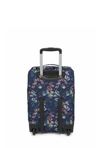 Rolkoffer met een marineblauw bloemenpatroon, harde kunststof basis, uitschuifbare handgreep en twee zwarte wielen voor mobiliteit.