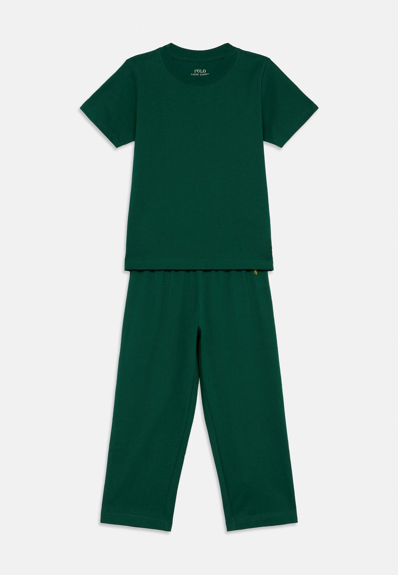 Zeleni bombažni komplet s kratkimi rokavi, ki obsega majico in hlače z elastičnim pasom, oba v gladki, enotni teksturi.