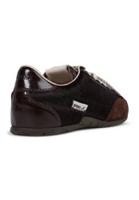 Brown and black sneaker with a mix of glossy and textured materials, featuring a prominent logo, lace closure, and a low profile design.