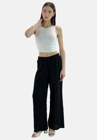 Elara MOUSELINE - Broek - schwarz