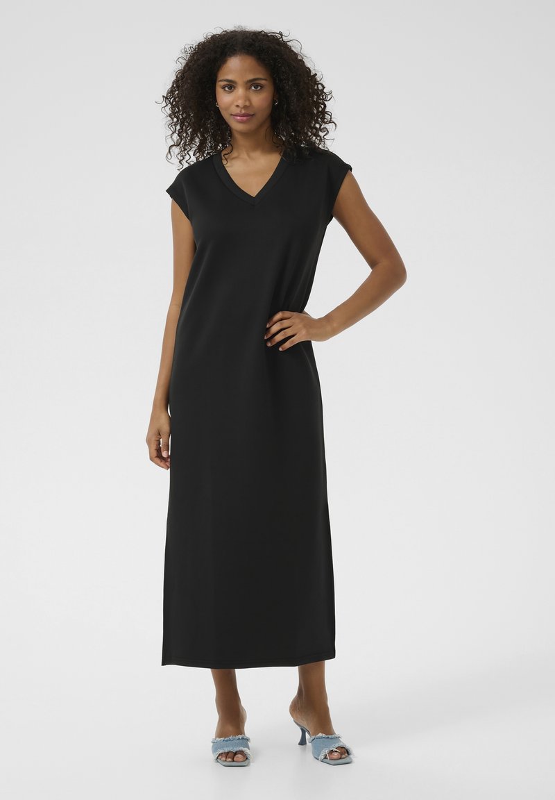 Robe maxi noire à manches courtes, décolleté en V et texture lisse. Présente une silhouette droite et s'étend jusqu'aux chevilles.