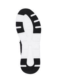 Sole of a sneaker featuring a black rubber tread with a white midsole, geometric grooves, and a textured surface for grip.