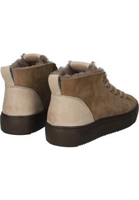 High-top sneakers made of light brown suede and leather, featuring a brown rubber sole, textured accents, and plush inner lining.