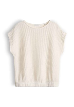 Haut en tricot à manches courtes de couleur crème avec texture côtelée, col rond et ourlet élastique.