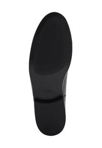 Svart skosula med en slät, strukturerad yta och rundad form. Har en ren kant och minimal varumärkeslogotyp på ytan.