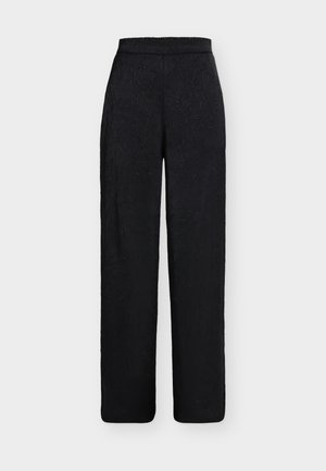 Pantalon noir taille haute à jambes larges avec un motif texturé subtil et une ceinture élastique sur fond blanc.