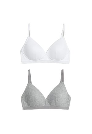 Two bras positioned vertically: one white, one gray. Both have triangular cups, thin adjustable straps, and soft fabric textures.